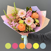 Bouquet of flowers with a gray background and color swatches below.